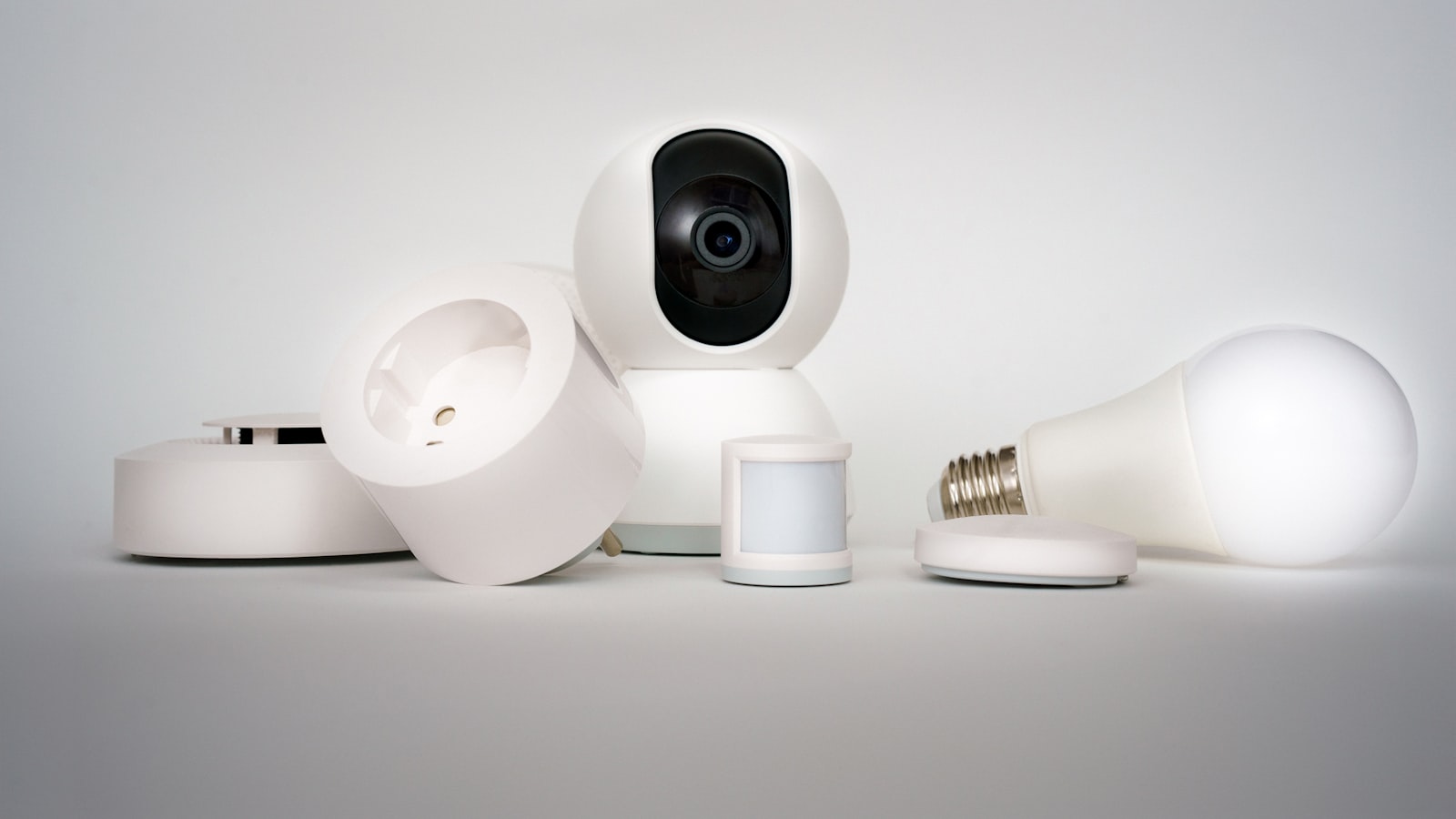 A smart camera, sensors, a smart plug and a smart bulb grouped together